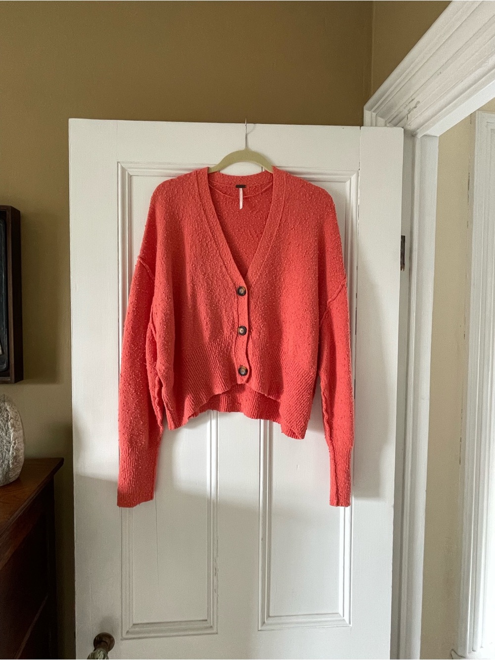 Free People cropped oversized coral sweater.